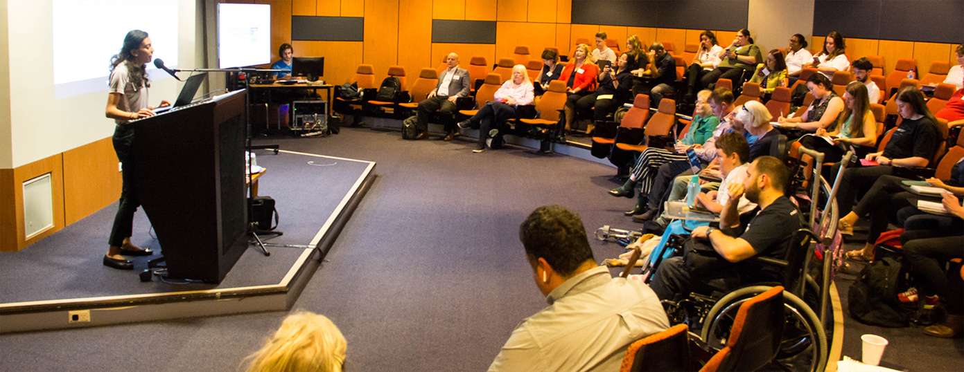 speaker and audience at an OZeWAI conference